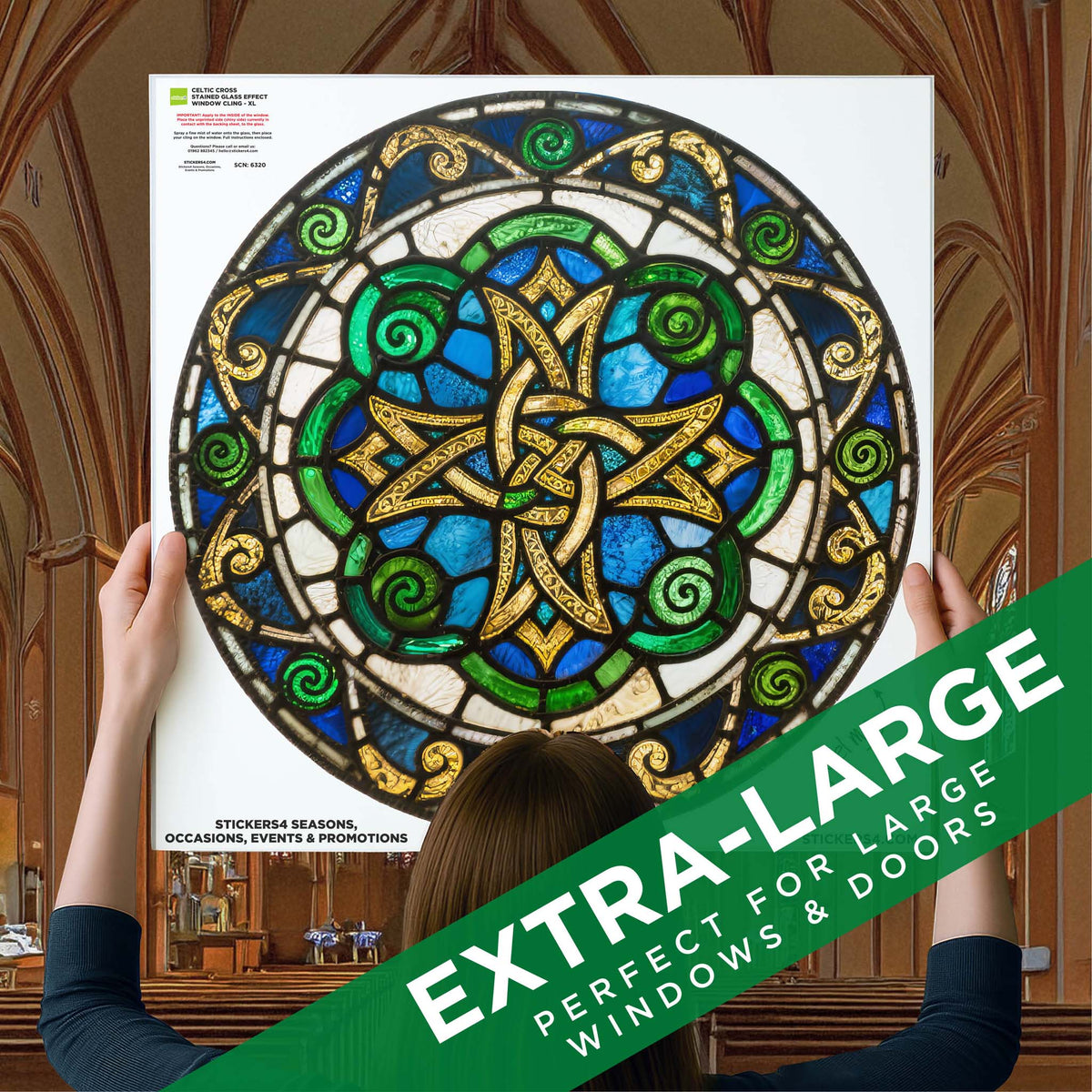 Person holding a large extra-large stained glass window panel in a cathedral setting