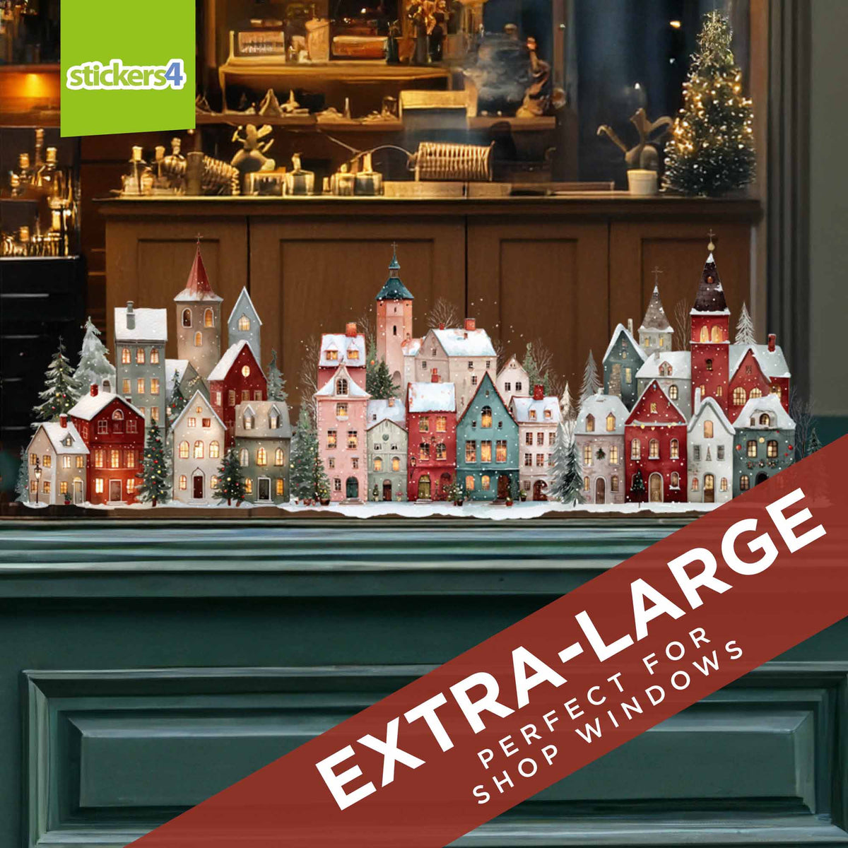 A large set of colorful Christmas village house stickers displayed on a dark green mantel in a decorated shop window setting.  'EXTRA-LARGE PERFECT FOR SHOP WINDOWS'