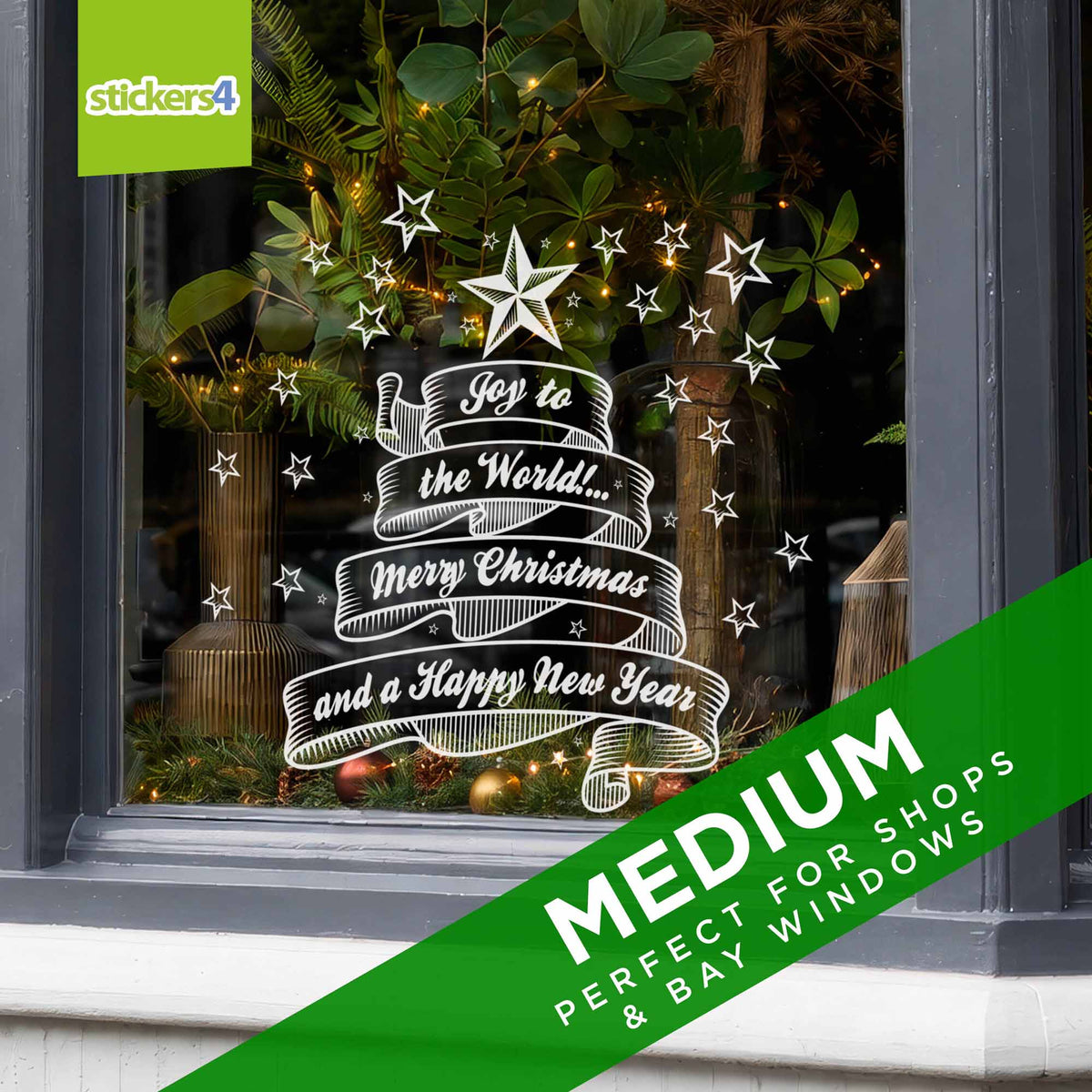 Medium Joy to the World Christmas window decoration on a festive bay window