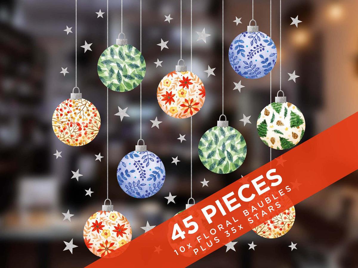 Decorative Christmas ornaments with floral patterns and stars on a blurred background