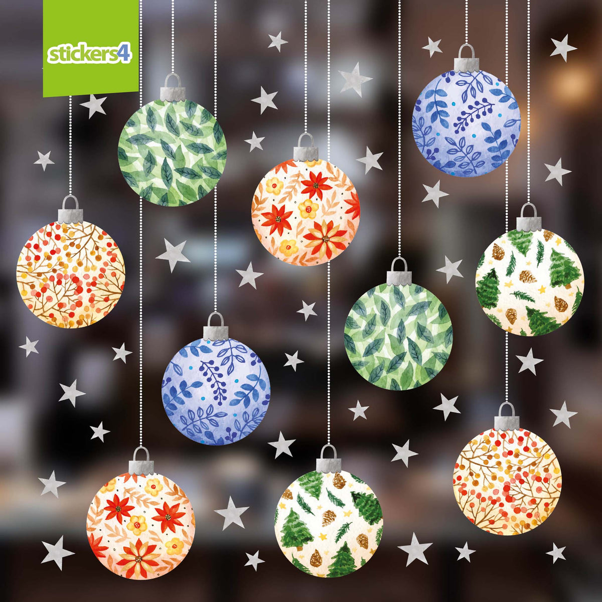 Decorative Christmas ornaments with floral patterns hanging against a blurred festive background.