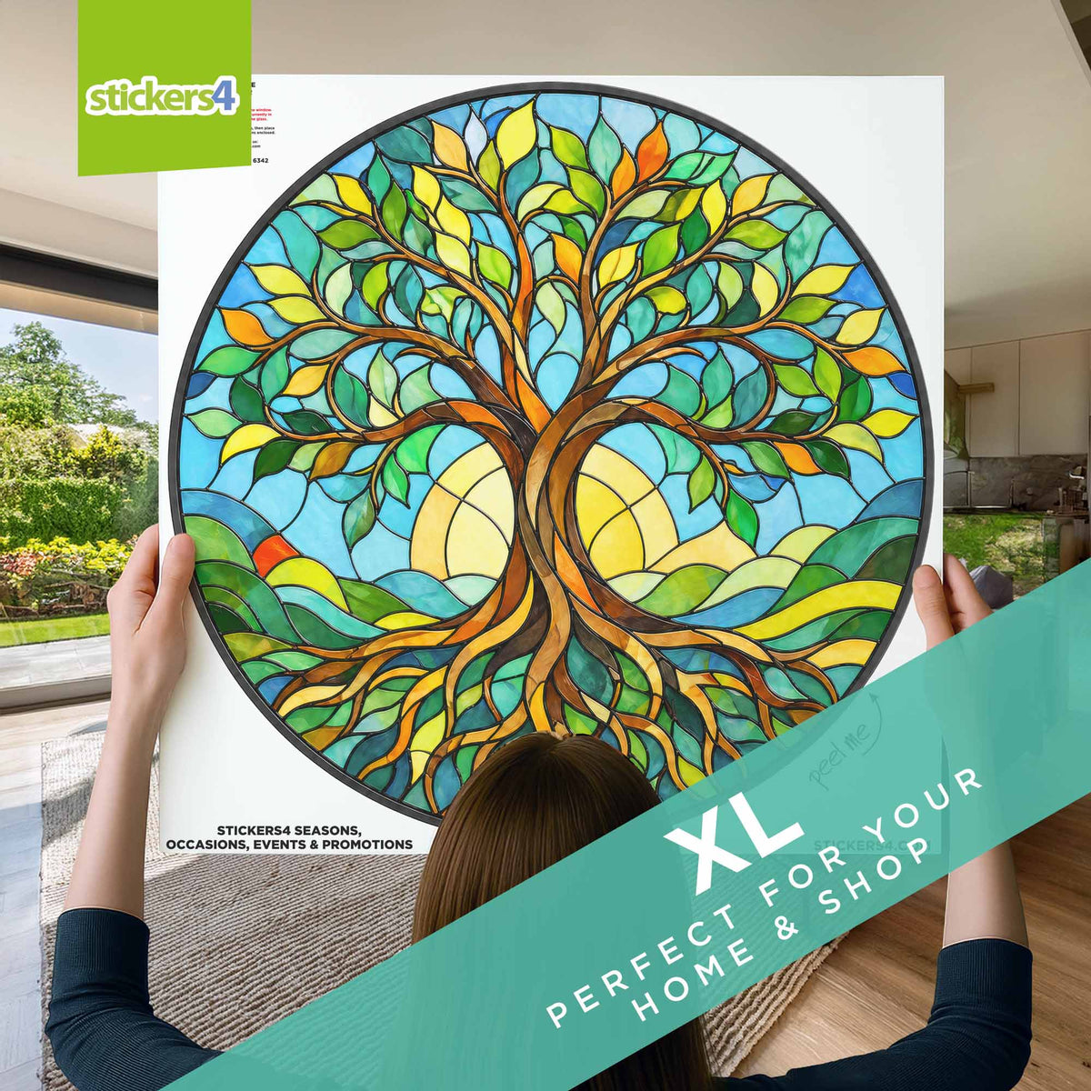 Person holding a large circular sticker of a colorful tree design with 'stickers4' branding.